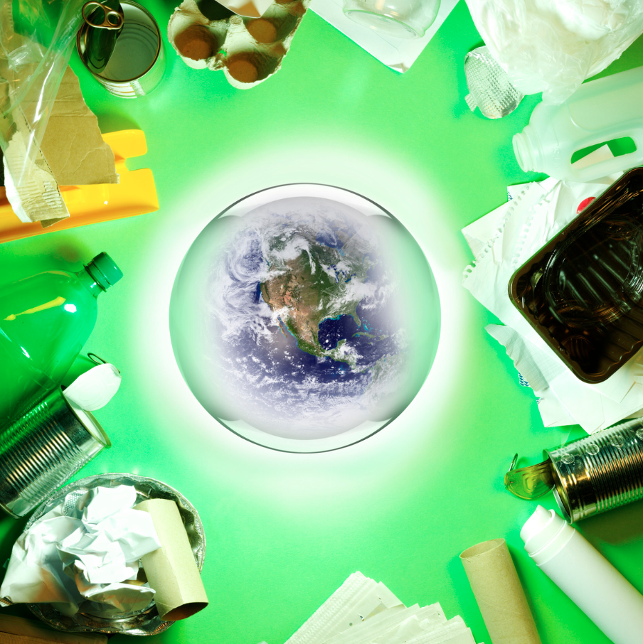 A globe surrounded by waste and recyclable materials symbolizing environmental challenges and solutions