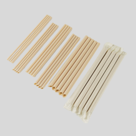 Set of eco-friendly bamboo straws in various lengths, with a few packaged straws wrapped for easy use.